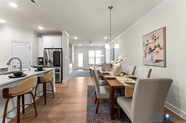 a large kitchen with a table and chairs