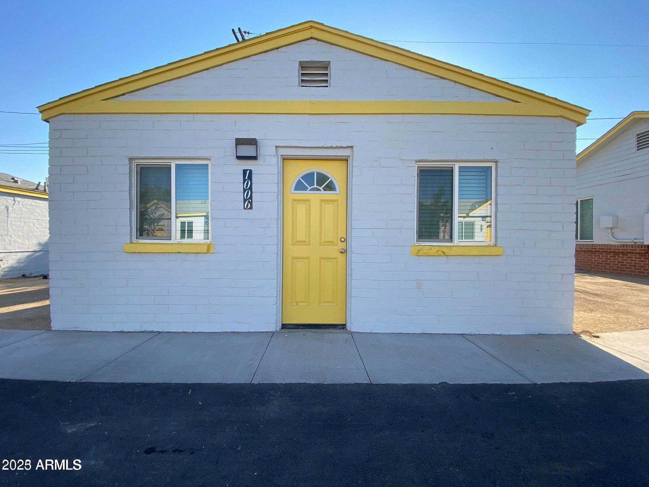 1620 East Apache Boulevard, Unit 1006 Tempe, AZ 85281 - Photo 12 of 12 a front view of a house with a yard