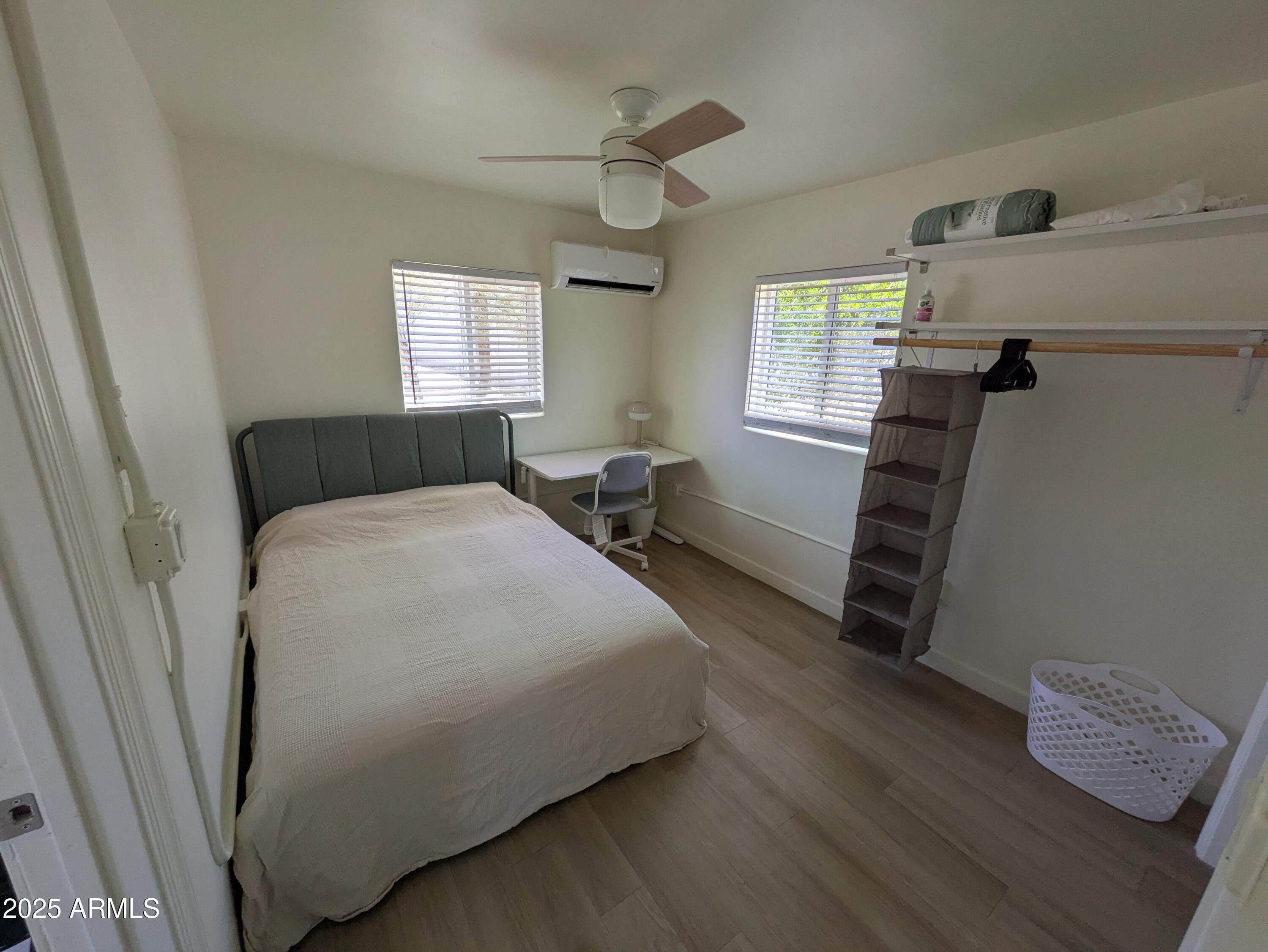 1620 East Apache Boulevard, Unit 1006 Tempe, AZ 85281 - Photo 10 of 12 a bedroom with a bed and a window
