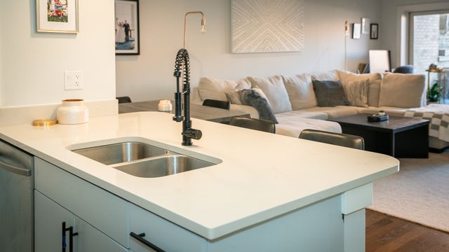 a kitchen with a sink and a refrigerator