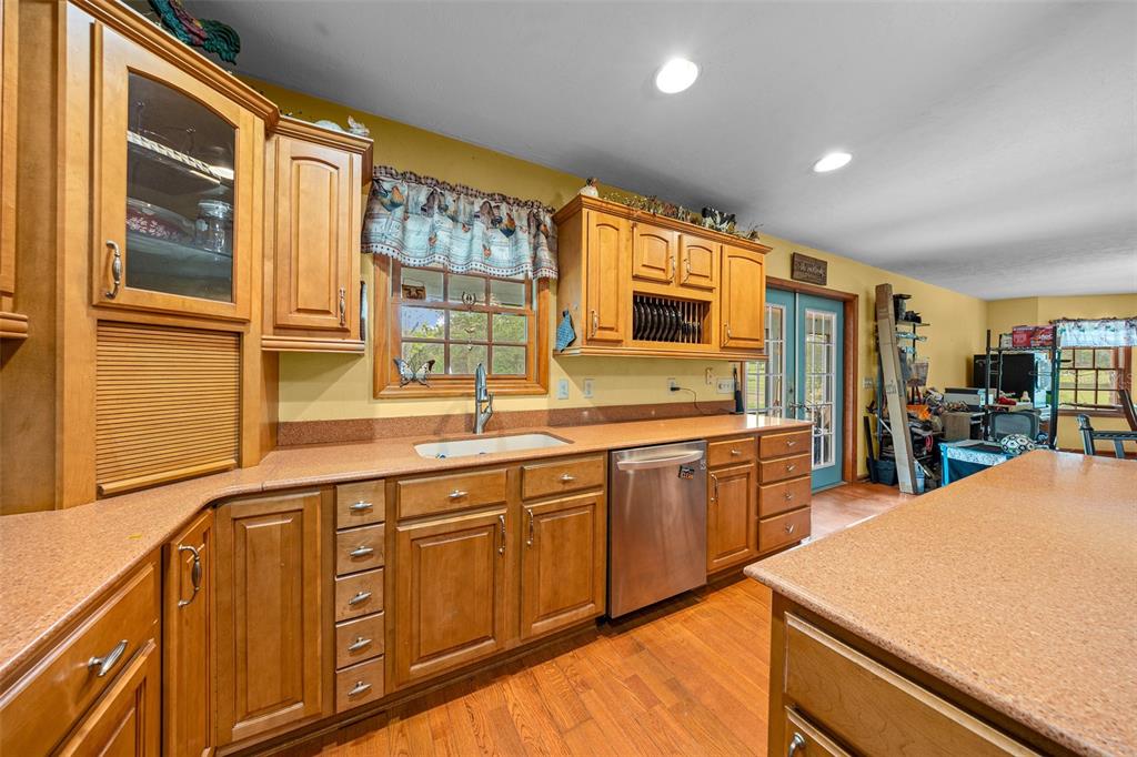 732 Carl Wilson Road Fort White, FL 32038 - Photo 6 of 80 a large kitchen with stainless steel appliances granite countertop a large window and a sink