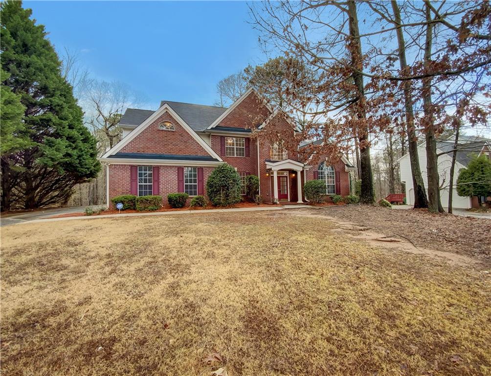 2215 Talbot Ridge Jonesboro, GA 30236 - Photo 1 of 1 a front view of a house with a yard