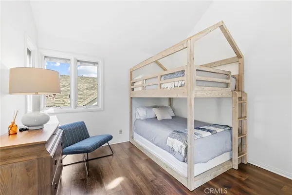 a bedroom with a bed and a workspace