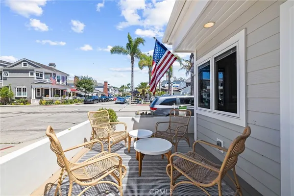 a view of a patio with table and chairs