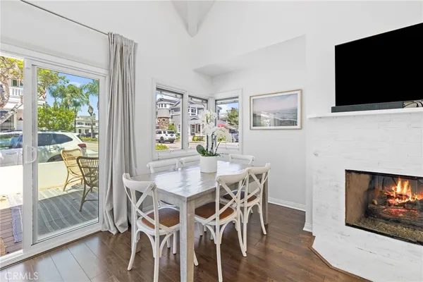 a view of a dining room with furniture wooden floor and flat screen tv