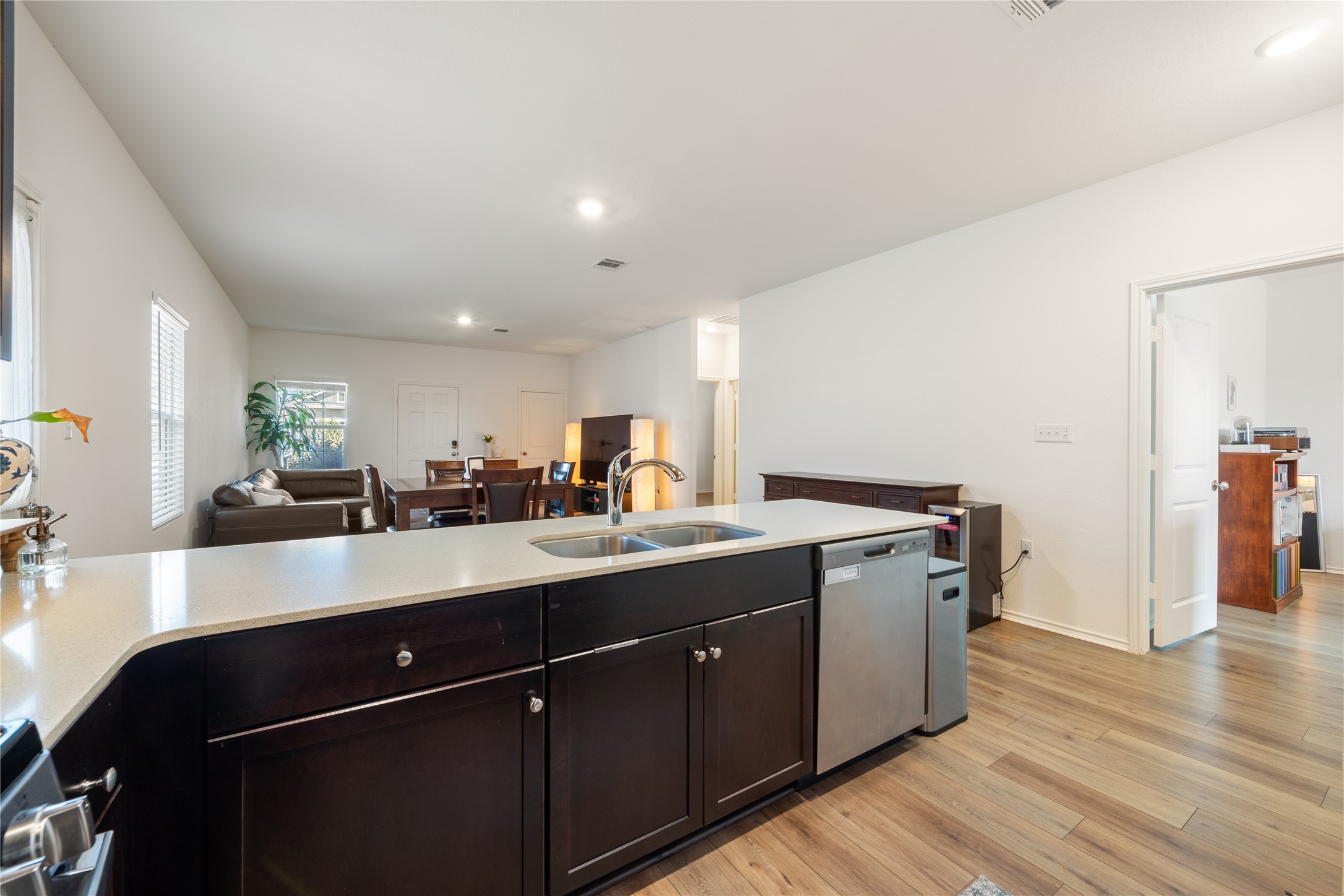 14404 Berning Road Manor, TX 78653 - Photo 13 of 38 A streamlined kitchen island offers seamless connectivity to living and dining areas, fostering effortless entertaining.