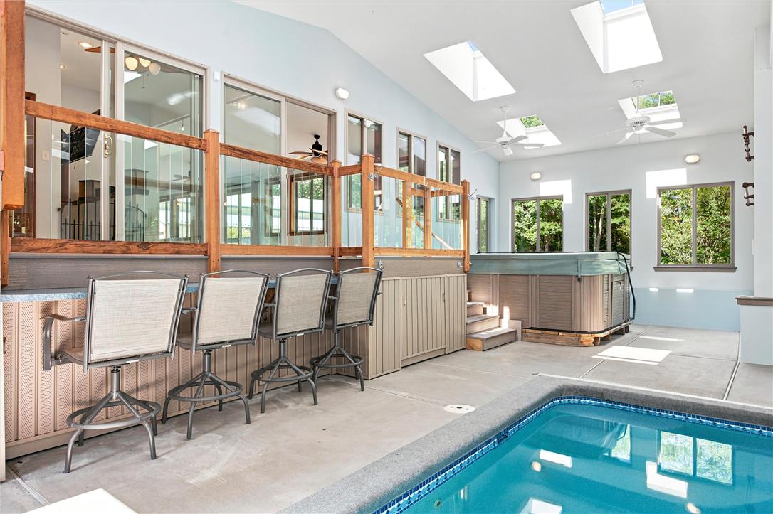 475 Crowthers Road Quakertown, PA 18951 - Photo 55 of 93 An inviting indoor oasis features a glistening pool, an adjacent hot tub, and bright skylights overhead.