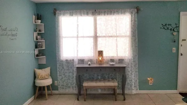 a room with a table and windows