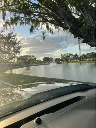 a view of a lake with houses in the back