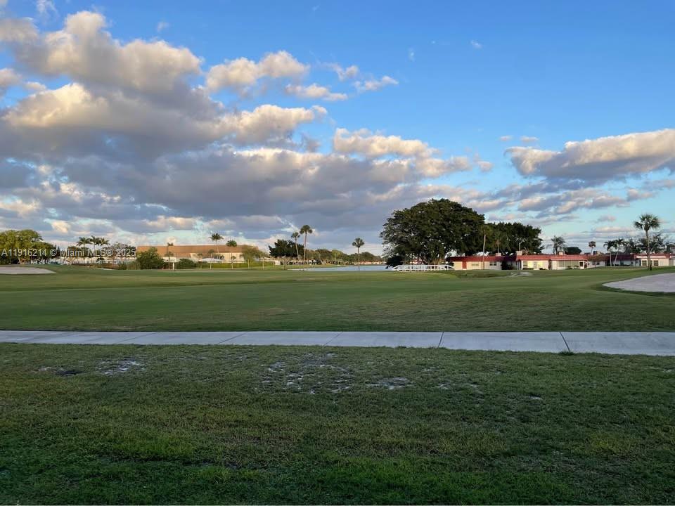 116 Tuscany Lane, Unit 116 Delray Beach, FL 33446 - Photo 8 of 12 a view of building with outdoor space