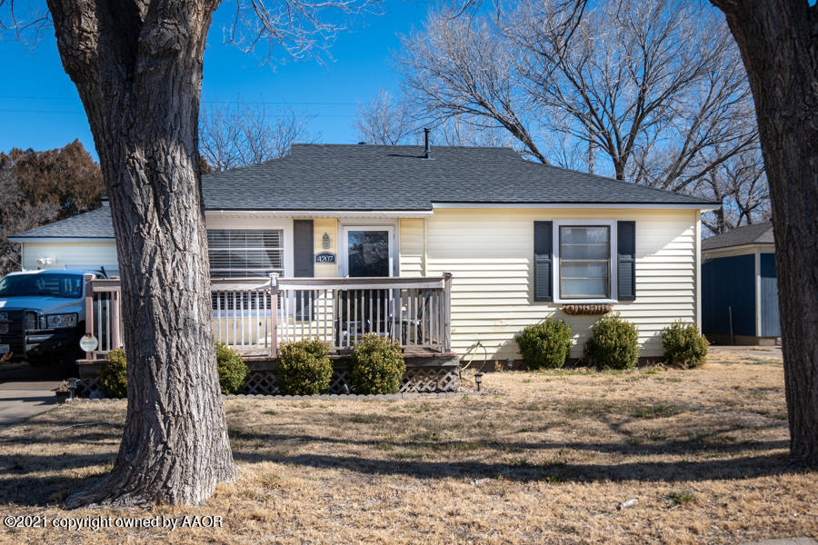 4207 South Lipscomb Street Amarillo, TX 79110 - Photo 2 of 23 a front view of a house with garden