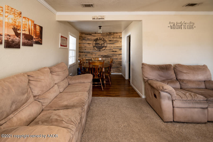 4207 South Lipscomb Street Amarillo, TX 79110 - Photo 6 of 23 a living room with furniture and a flat screen tv