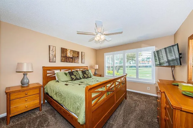 a bed room with a bed and a window