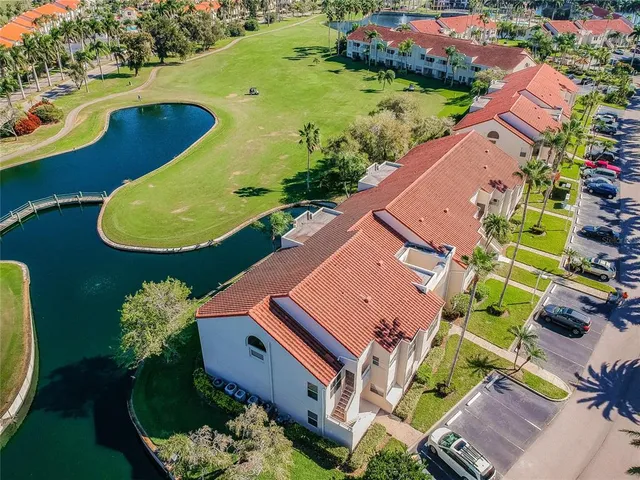 an aerial view of a house with a swimming pool yard and outdoor seating