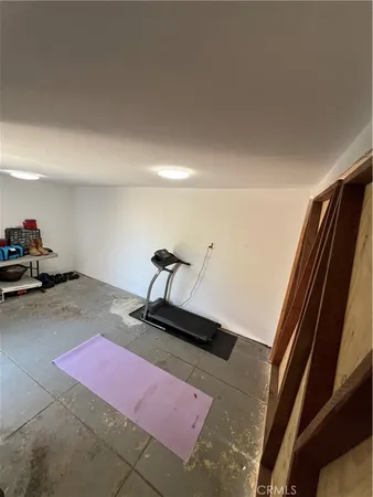 a bedroom with a bed and a mirror