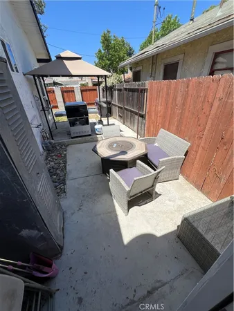 a roof deck with a table and chairs