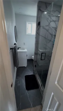 a bathroom with a bathtub and toilet