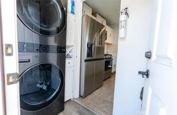 a close view of a utility room with washer and dryer