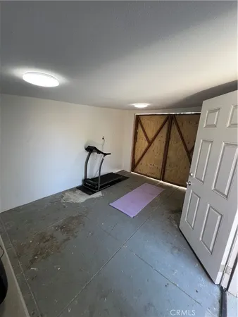 a room with furniture and white walls