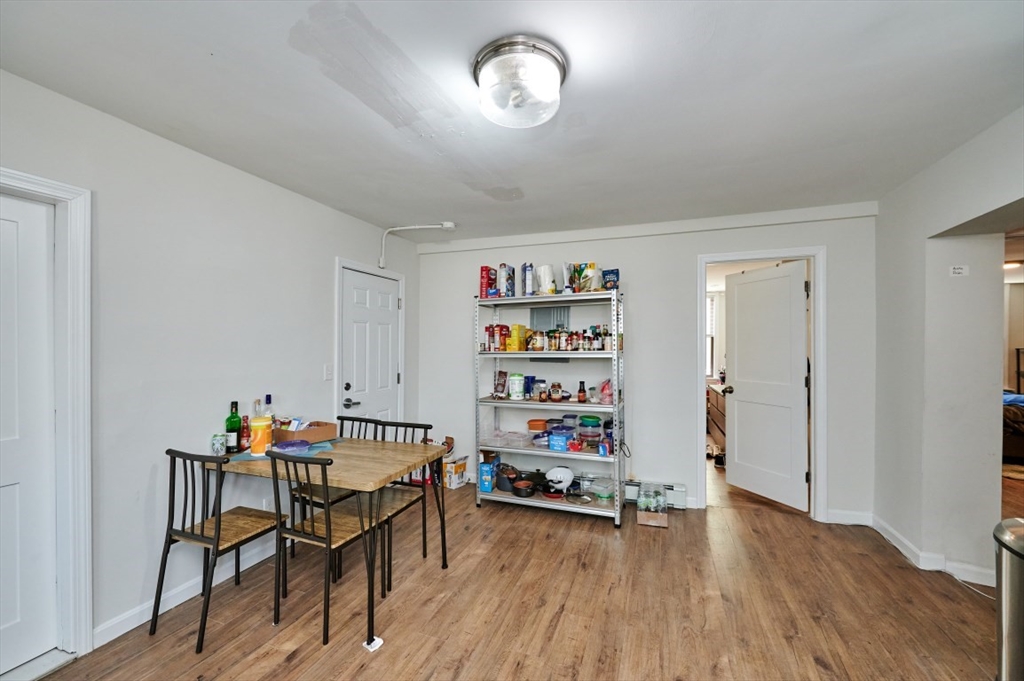 241-243 E Street Boston, MA 02127 - Photo 4 of 16 a workspace with furniture and wooden floor