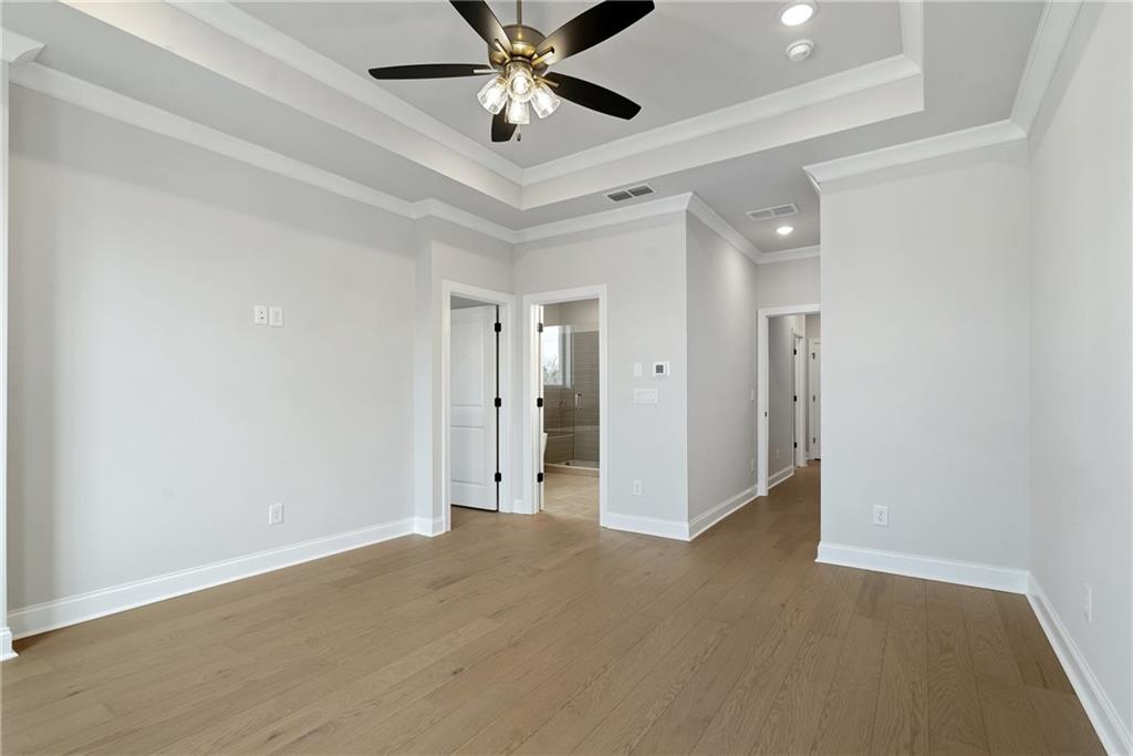 502 Whatton Road, Unit 1 Johns Creek, GA 30022 - Photo 17 of 34 an empty room with closet and a chandelier fan