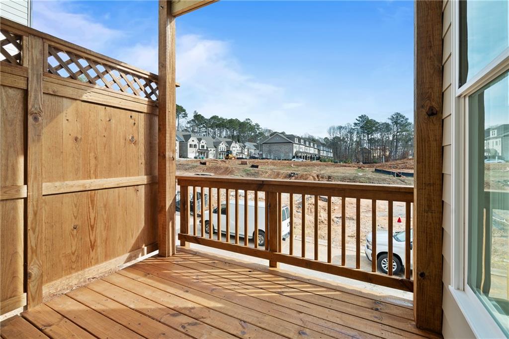 502 Whatton Road, Unit 1 Johns Creek, GA 30022 - Photo 22 of 34 a view of a balcony with wooden floor