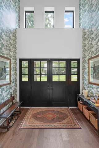 a living room with furniture rug and window