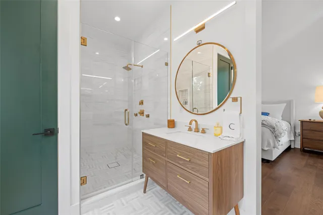 a bathroom with a sink double vanity and a mirror