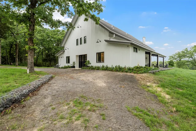 a view of a city from a balcony with a garden