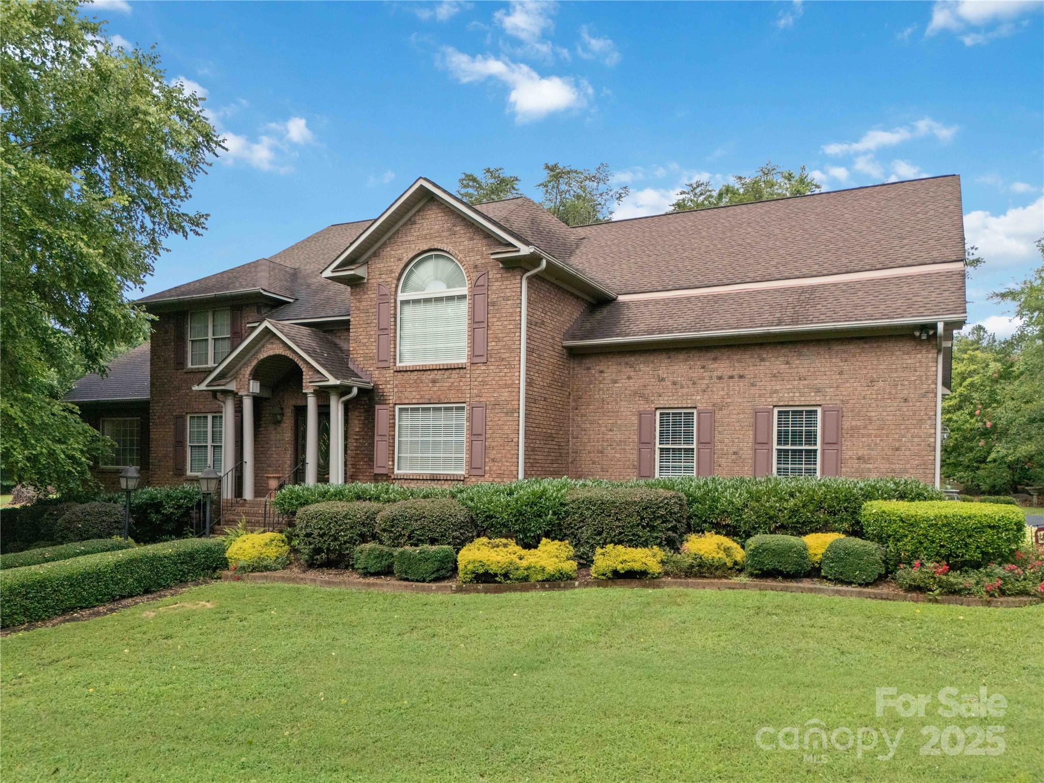 865 State Rd S-46-151 Clover, SC 29710 - Photo 2 of 48 a front view of a house with a yard and garage