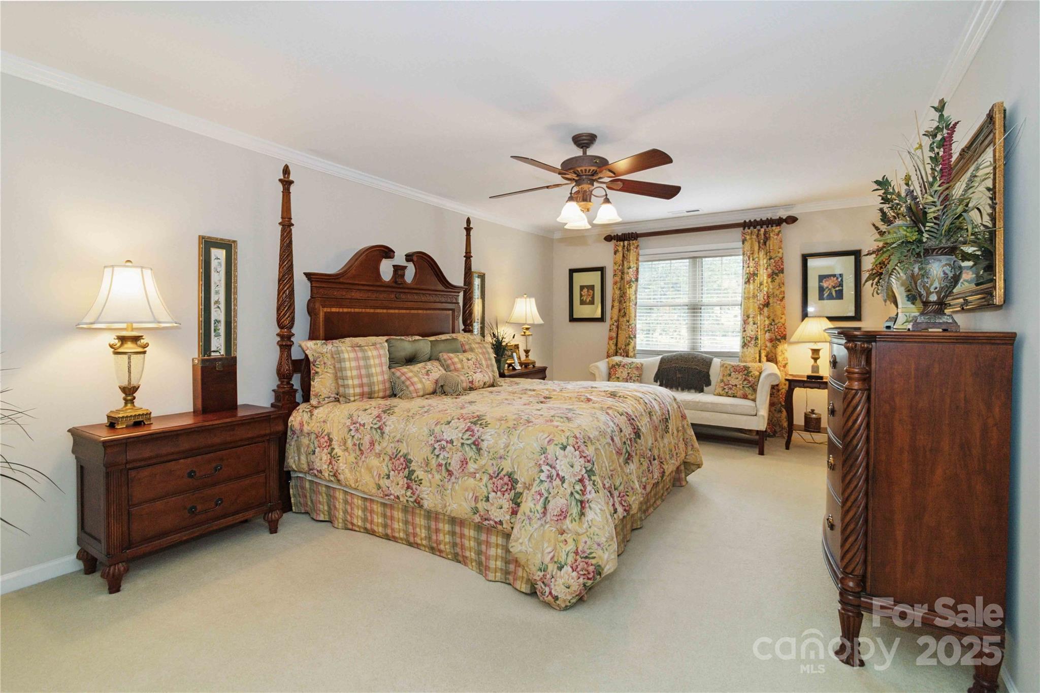 865 State Rd S-46-151 Clover, SC 29710 - Photo 21 of 48 a spacious bedroom with a bed and a chandelier