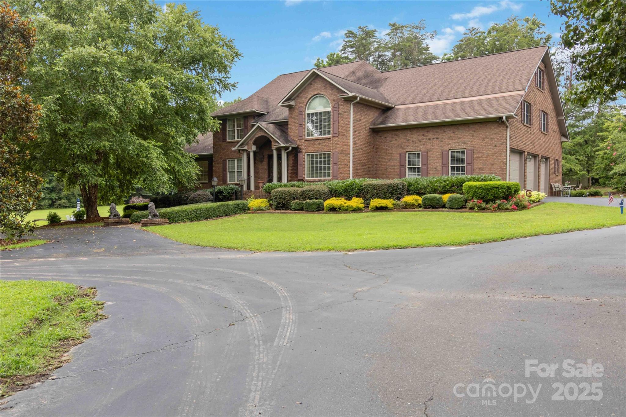 865 State Rd S-46-151 Clover, SC 29710 - Photo 3 of 48 a front view of a house with a yard and garage