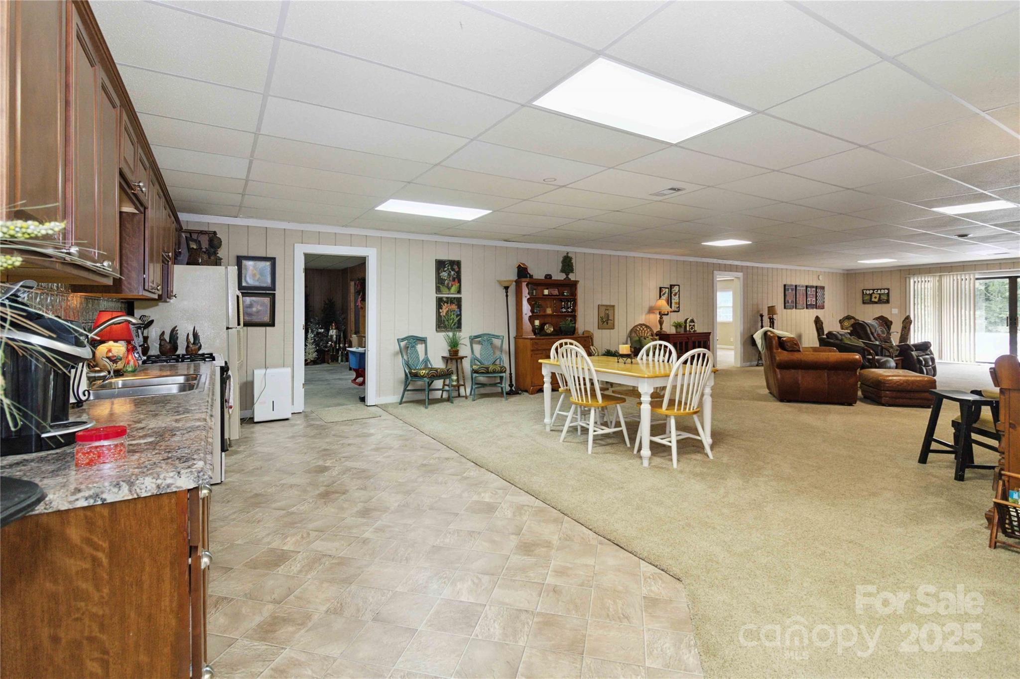 865 State Rd S-46-151 Clover, SC 29710 - Photo 37 of 48 a living room with furniture a clock and a flat screen tv
