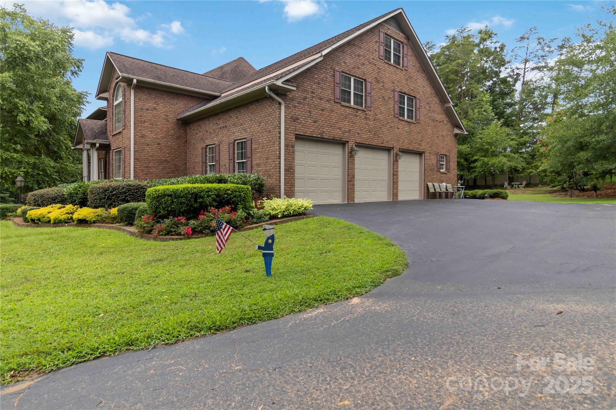 865 State Rd S-46-151 Clover, SC 29710 - Photo 4 of 48 a front view of a house with a yard and garage