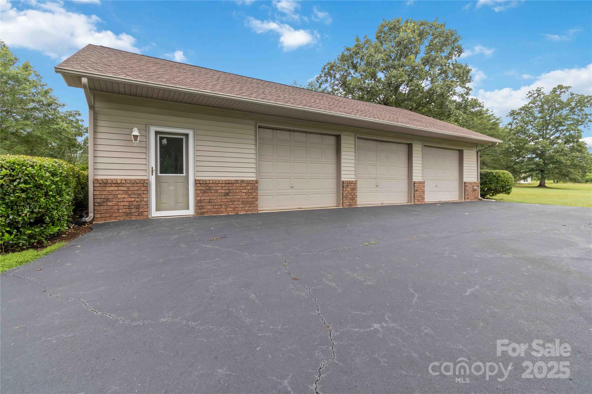 865 State Rd S-46-151 Clover, SC 29710 - Photo 41 of 48 a view of a house with a yard and garage