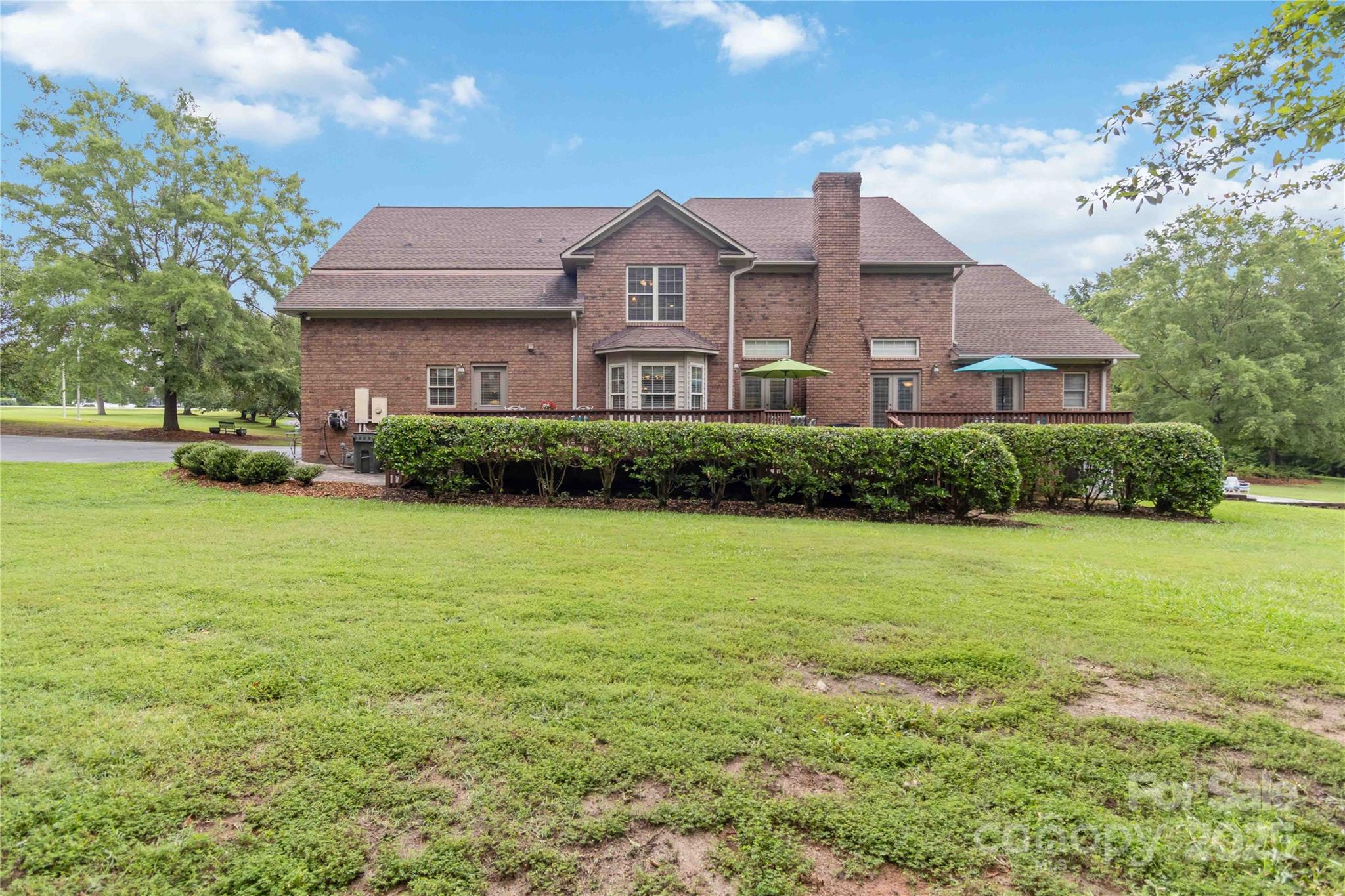 865 State Rd S-46-151 Clover, SC 29710 - Photo 43 of 48 a front view of a house with a garden
