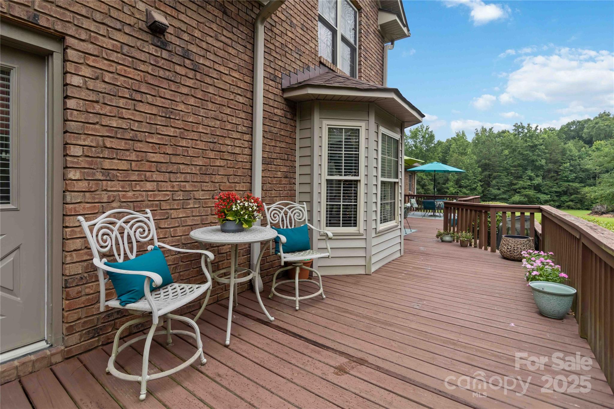 865 State Rd S-46-151 Clover, SC 29710 - Photo 46 of 48 a view of a patio with a table and chairs