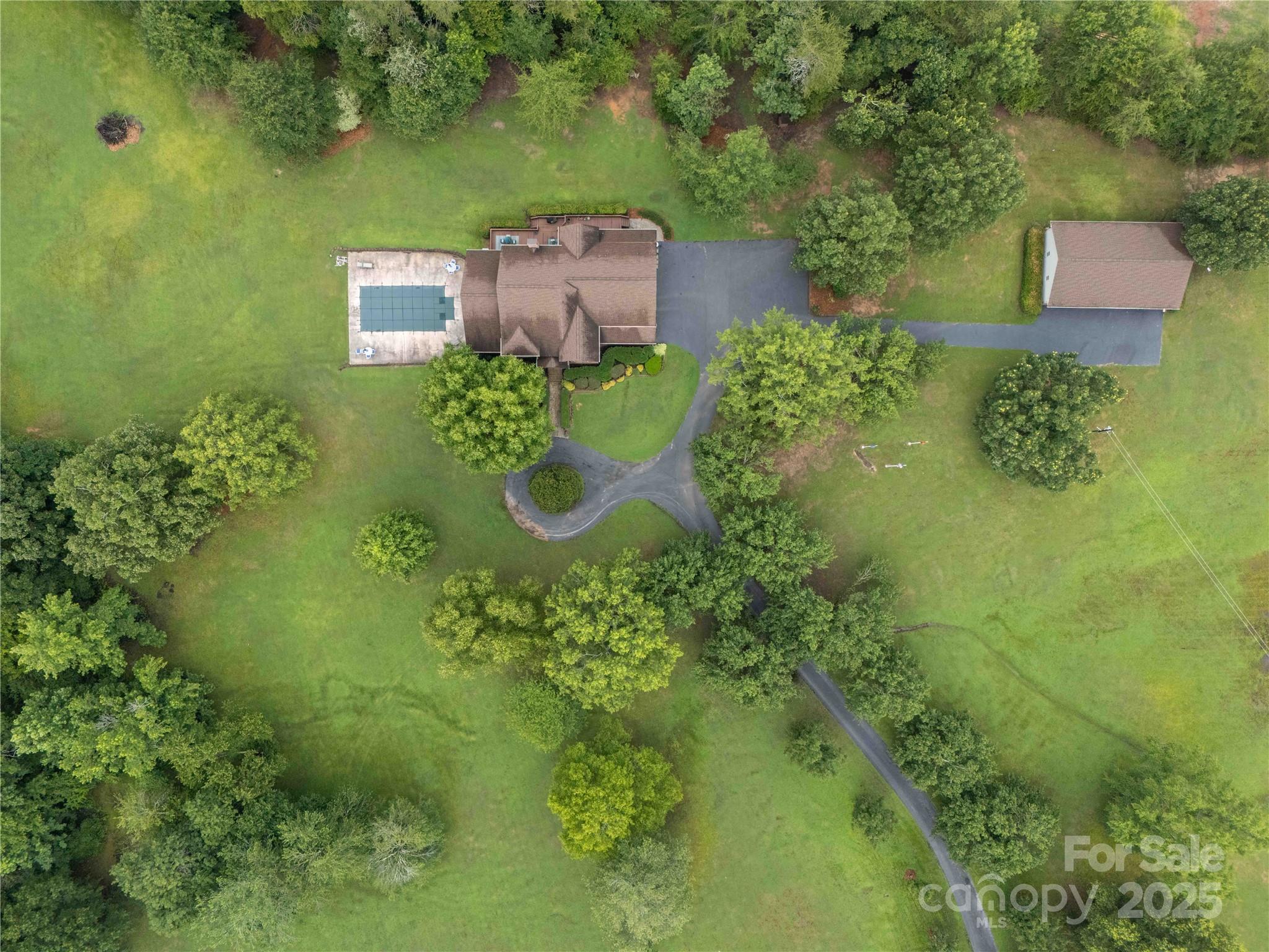 865 State Rd S-46-151 Clover, SC 29710 - Photo 47 of 48 an aerial view of a house with a yard swimming pool and outdoor seating