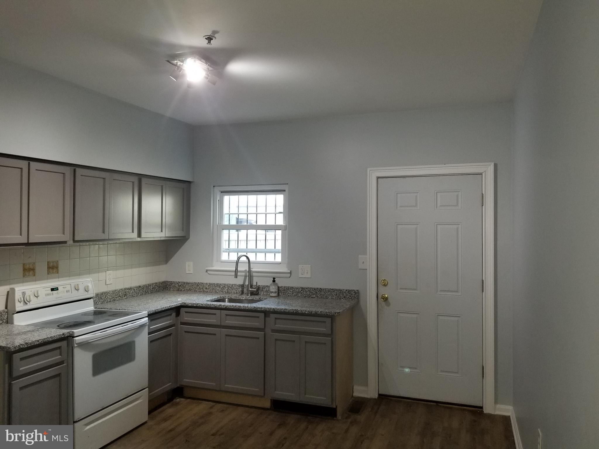 1624 West Lexington Street Baltimore, MD 21223 - Photo 25 of 63 a kitchen with sink cabinets and window