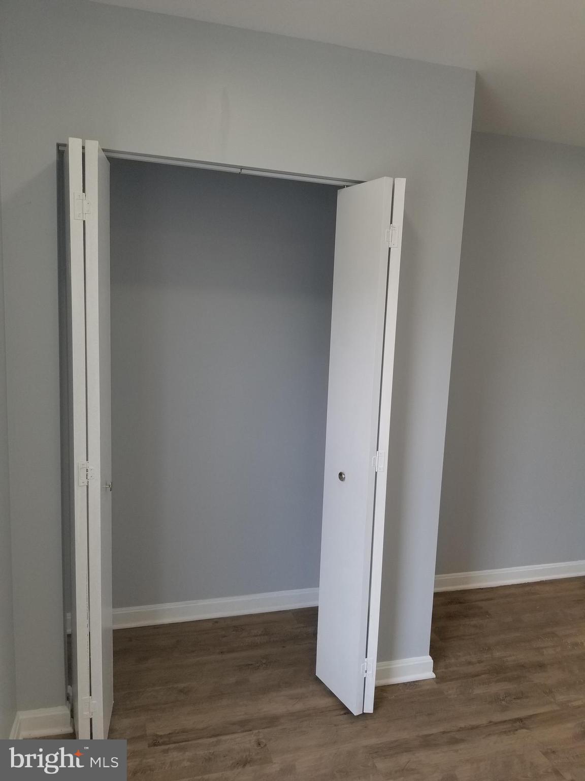 1624 West Lexington Street Baltimore, MD 21223 - Photo 49 of 63 a view of a hallway with wooden floor