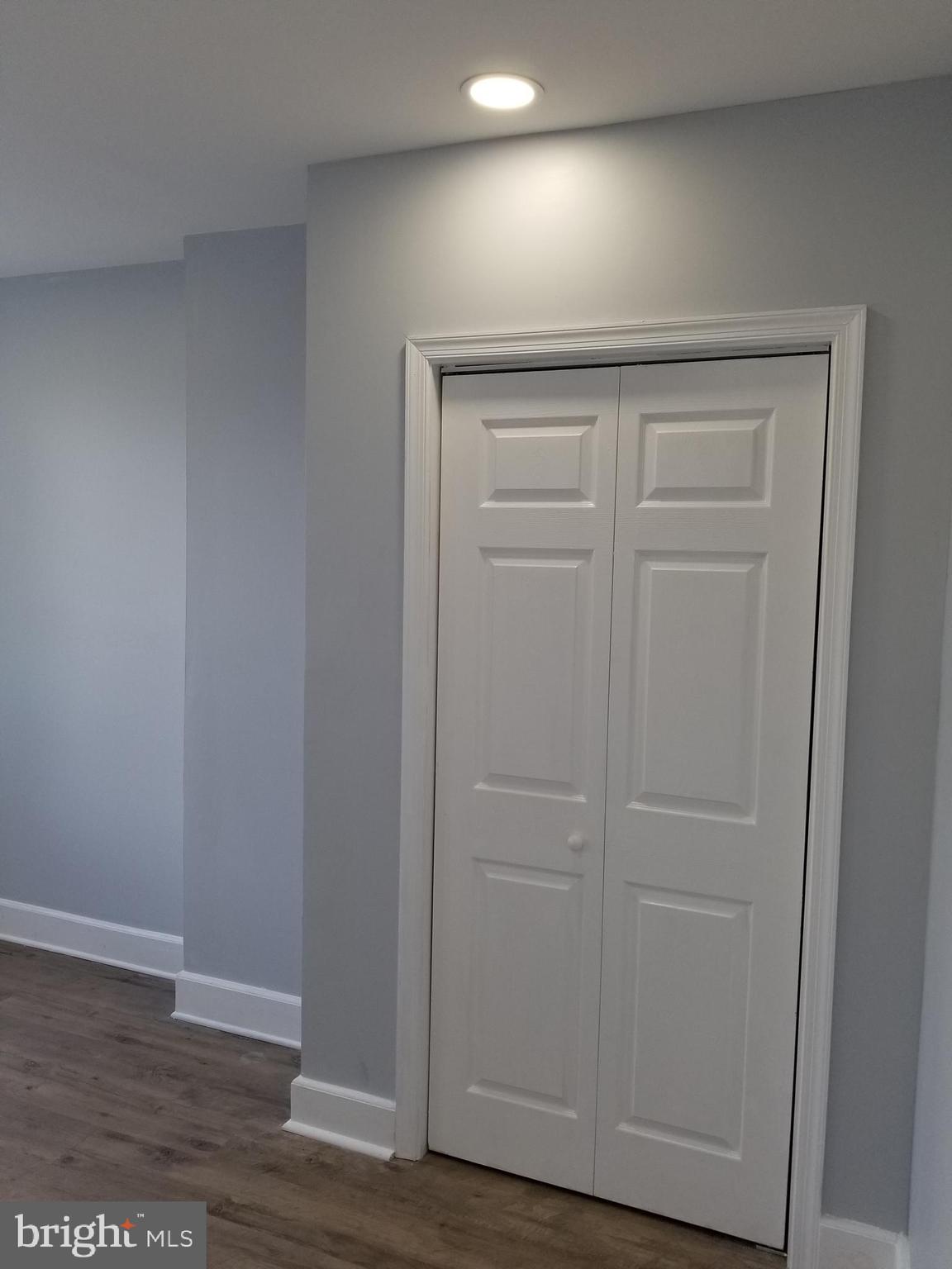 1624 West Lexington Street Baltimore, MD 21223 - Photo 54 of 63 wooden floor in an empty room