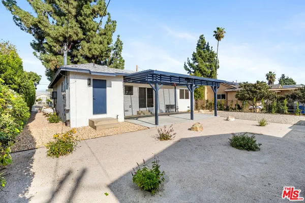 a view of a house with a sink and yard