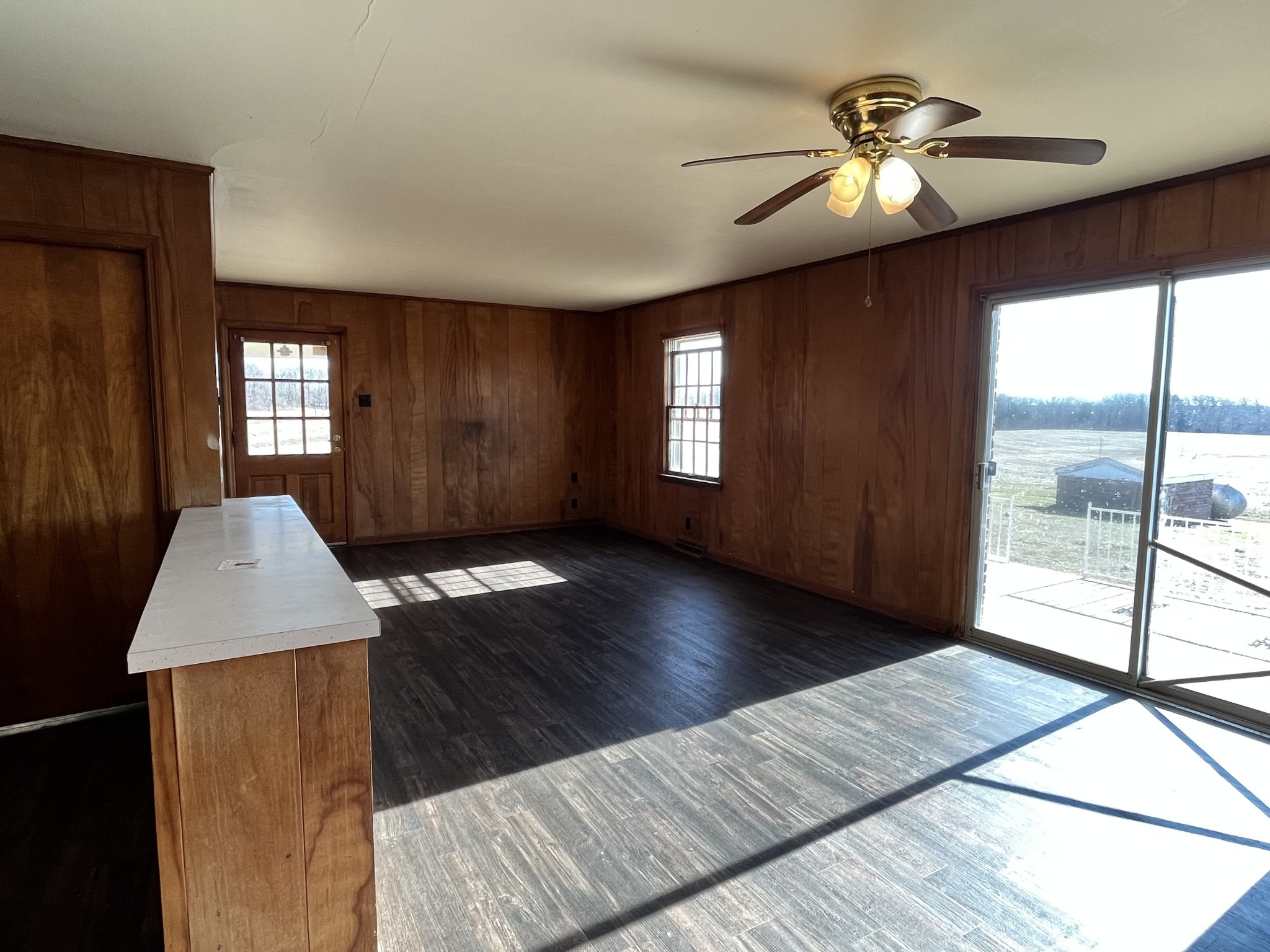 14403 Newstead Road Herndon, KY 42236 - Photo 6 of 25 a view of an empty room with window and wooden floor