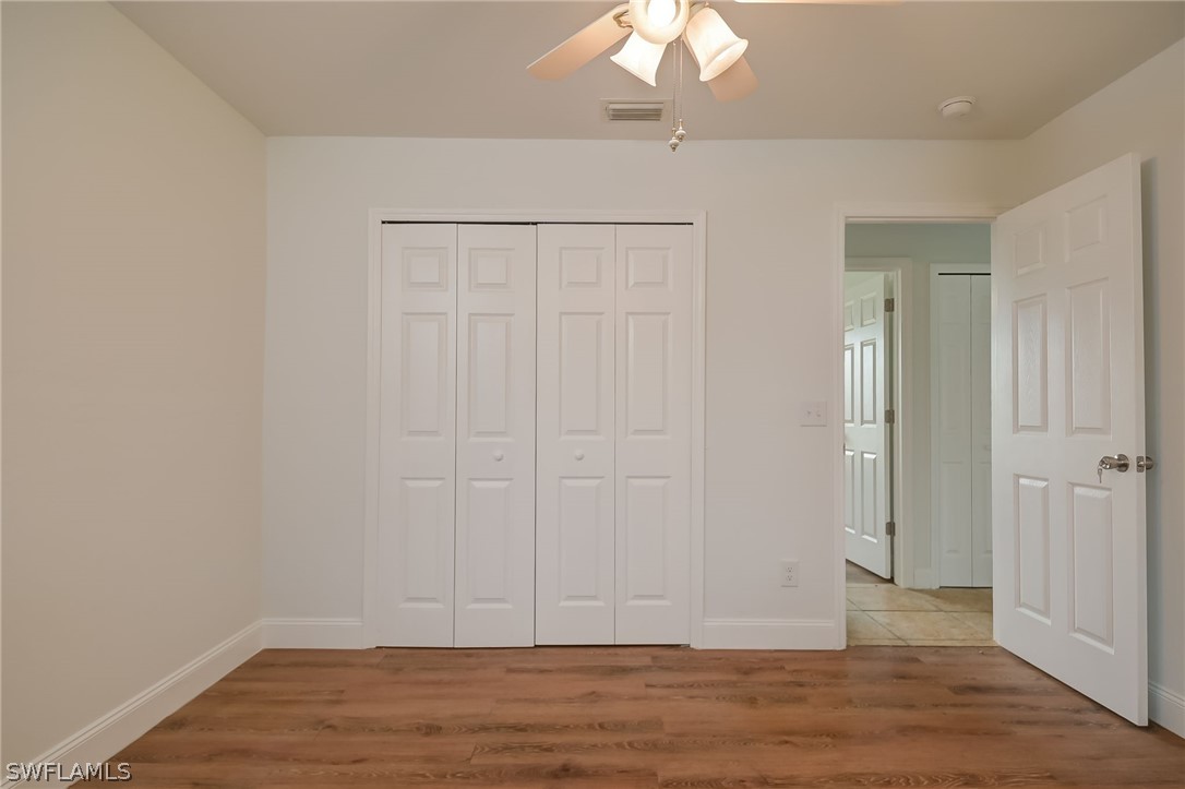18298 Hepatica Road Fort Myers, FL 33967 - Photo 18 of 25 wooden floor in an empty room