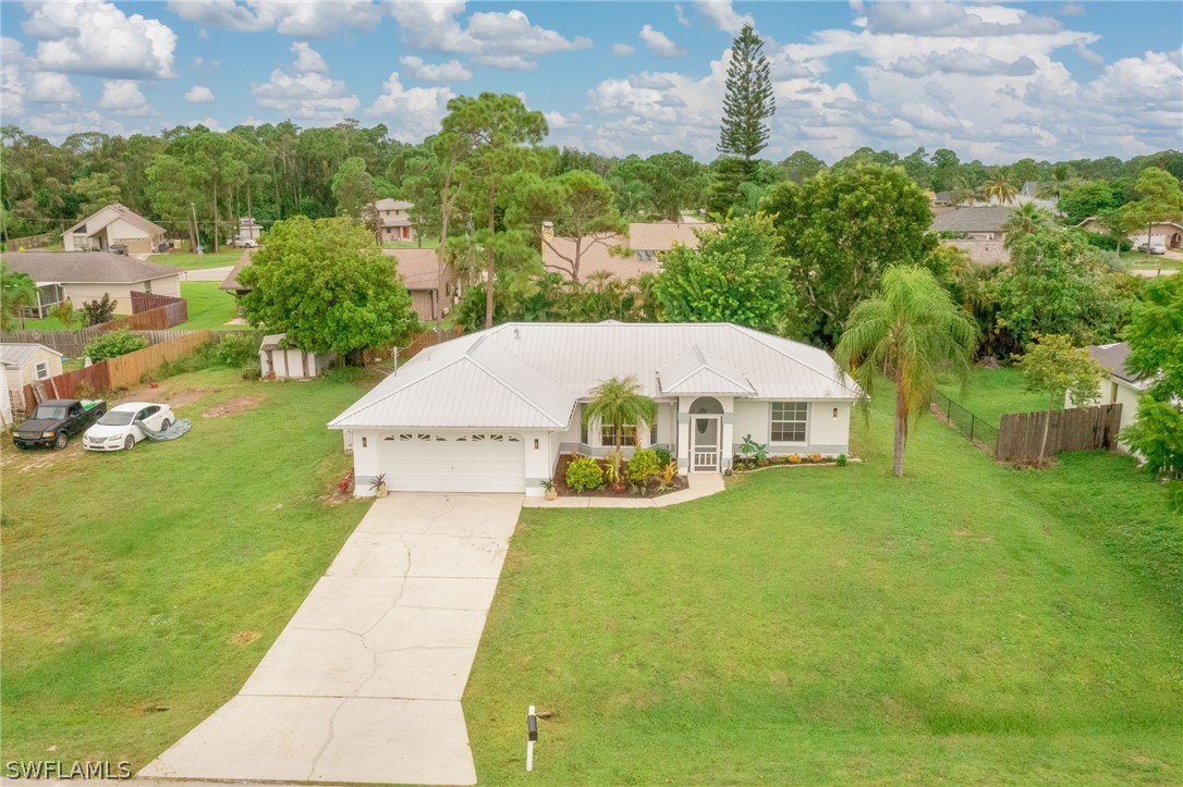 18298 Hepatica Road Fort Myers, FL 33967 - Photo 2 of 25 a view of a patio with a yard