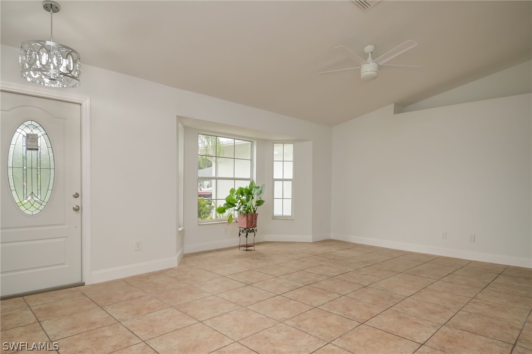 18298 Hepatica Road Fort Myers, FL 33967 - Photo 3 of 25 an empty room with windows