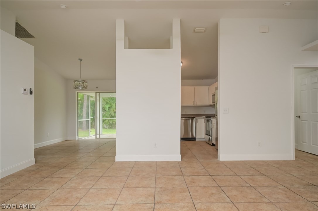 18298 Hepatica Road Fort Myers, FL 33967 - Photo 4 of 25 a view of an empty room with a bathroom