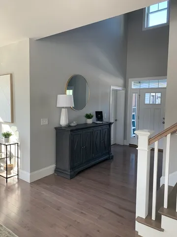 a view of room with furniture and wooden floor