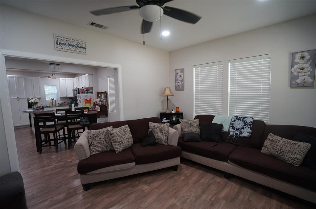 2115 Reuter Avenue Waco, TX 76708 - Photo 3 of 11 a living room with furniture and wooden floor