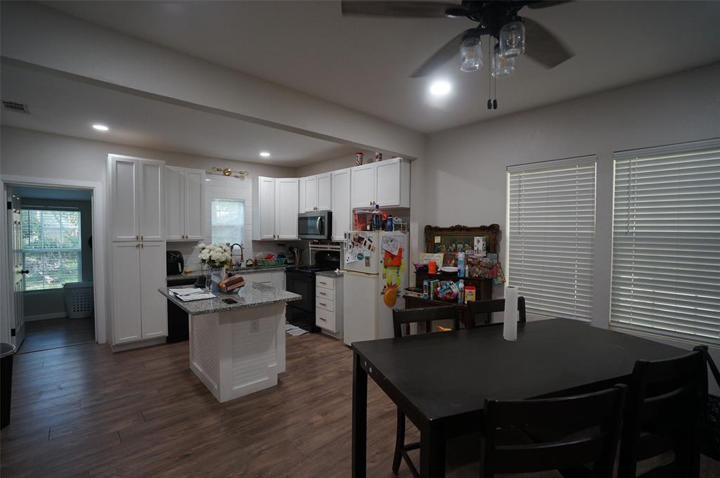 2115 Reuter Avenue Waco, TX 76708 - Photo 5 of 11 a kitchen and a table in a kitchen